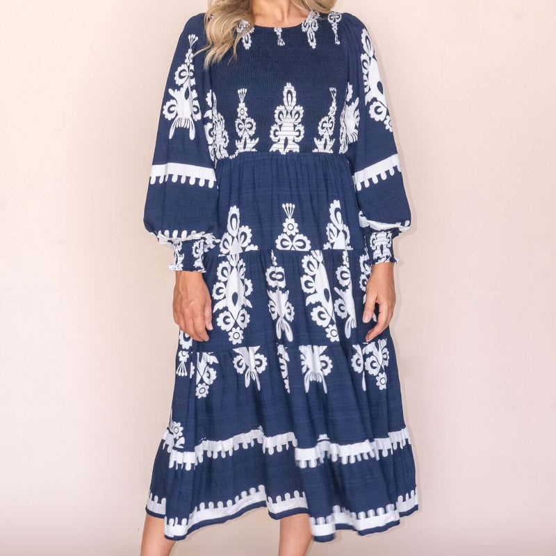Whisper Midi Dress in Navy, available at: https://www.daltik.com/