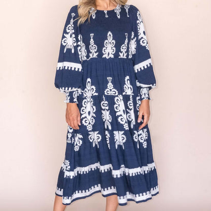 Whisper Midi Dress in Navy, available at: https://www.daltik.com/