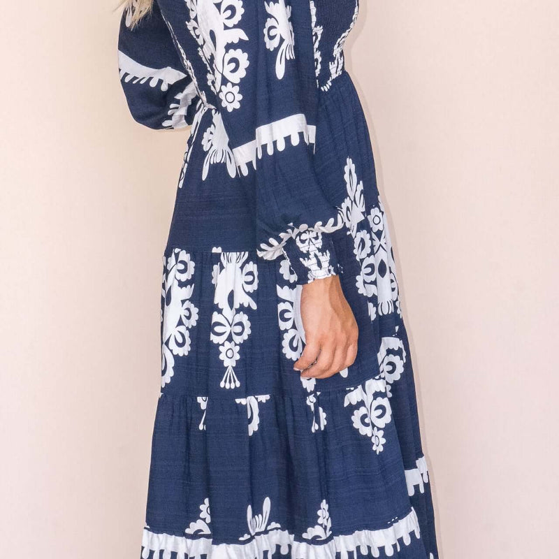 Whisper Midi Dress in Navy, available at: https://www.daltik.com/