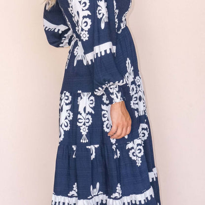 Whisper Midi Dress in Navy, available at: https://www.daltik.com/