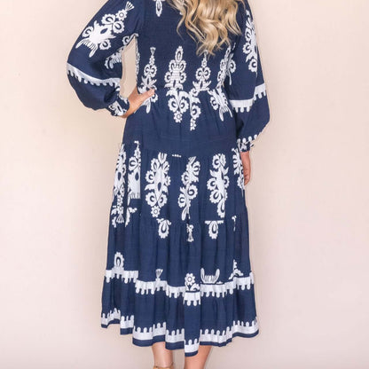Whisper Midi Dress in Navy, available at: https://www.daltik.com/