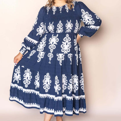 Whisper Midi Dress in Navy, available at: https://www.daltik.com/