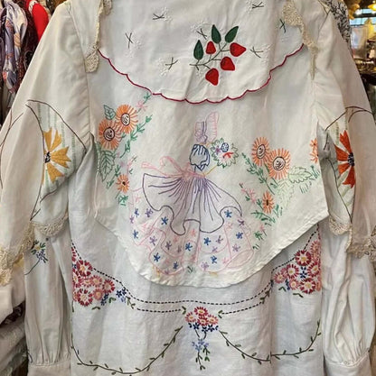 Handmade White Embroidered Patchwork Cotton Blouse, available at: https://www.daltik.com/